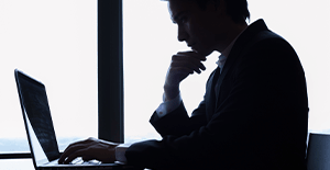 IT specialist examining data on computer